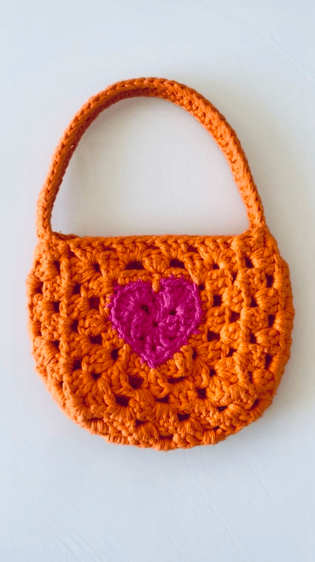 Sac Bourse Akoma, vert et rose fuchsia 